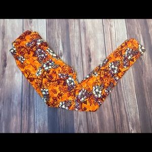 LulaRoe Orange, multicolored floral print leggings. One Size. (6)